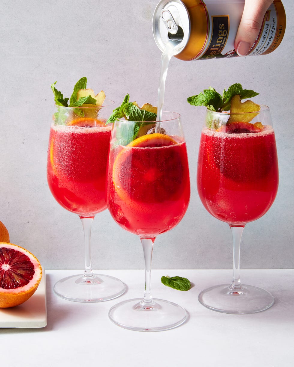 blood orange mocktail with a blood orange slice, mint, and ginger