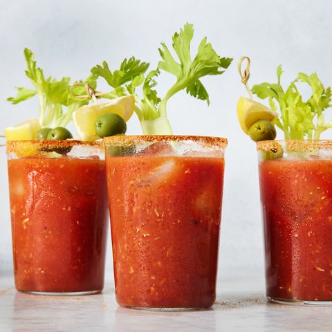 bloody mary garnished with lemon, celery, and olives