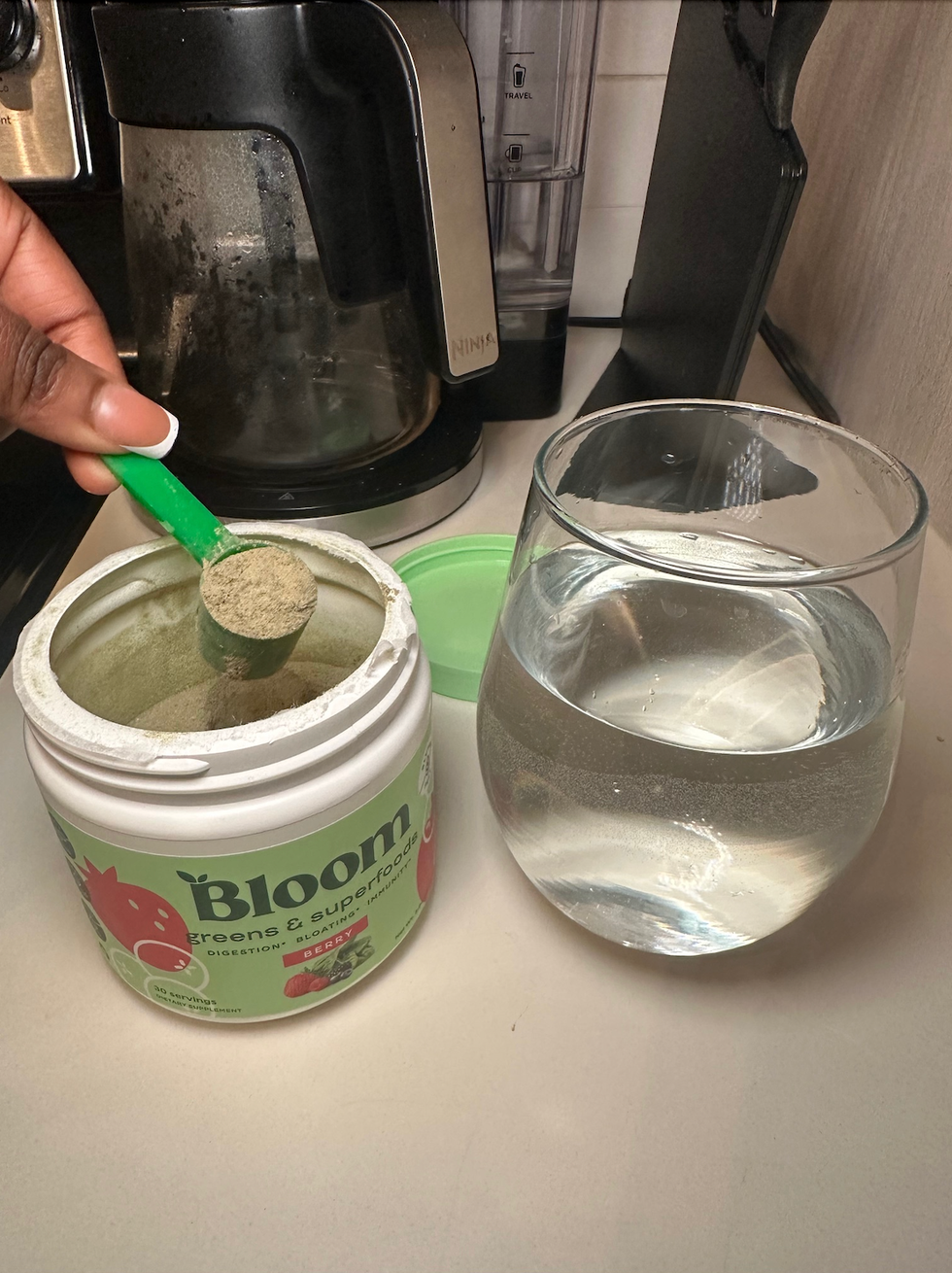 bloom greens and superfoods blend being prepared in the author's home