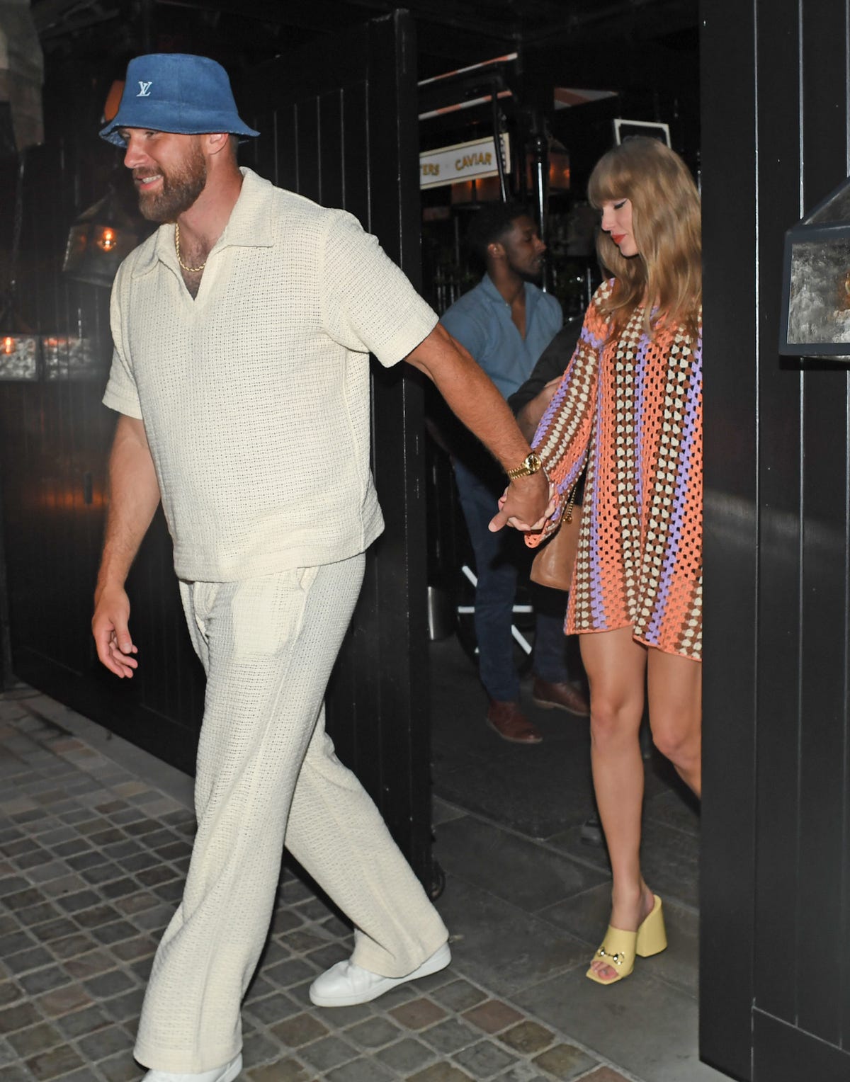 Taylor Swift Looks So ’70s in a Crochet Minidress for London Date With Travis Kelce