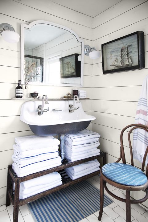 white shiplapped bathroom with blue and white