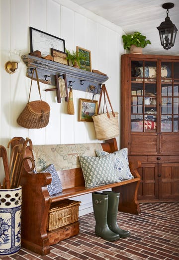 farmhouse mudroom with brick floor