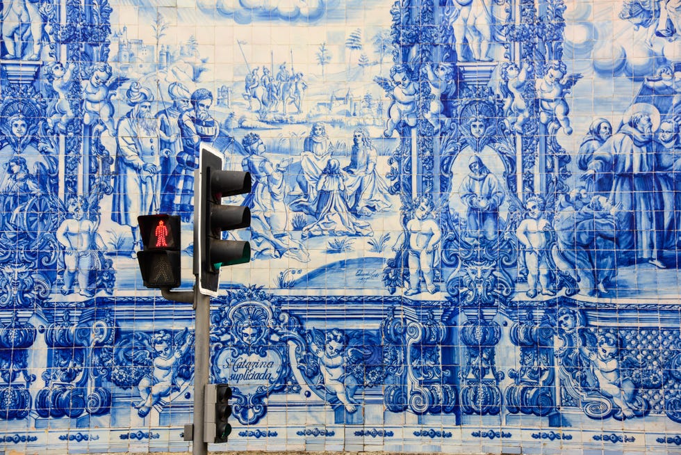 blue and white tiles of chapel of souls in porto
