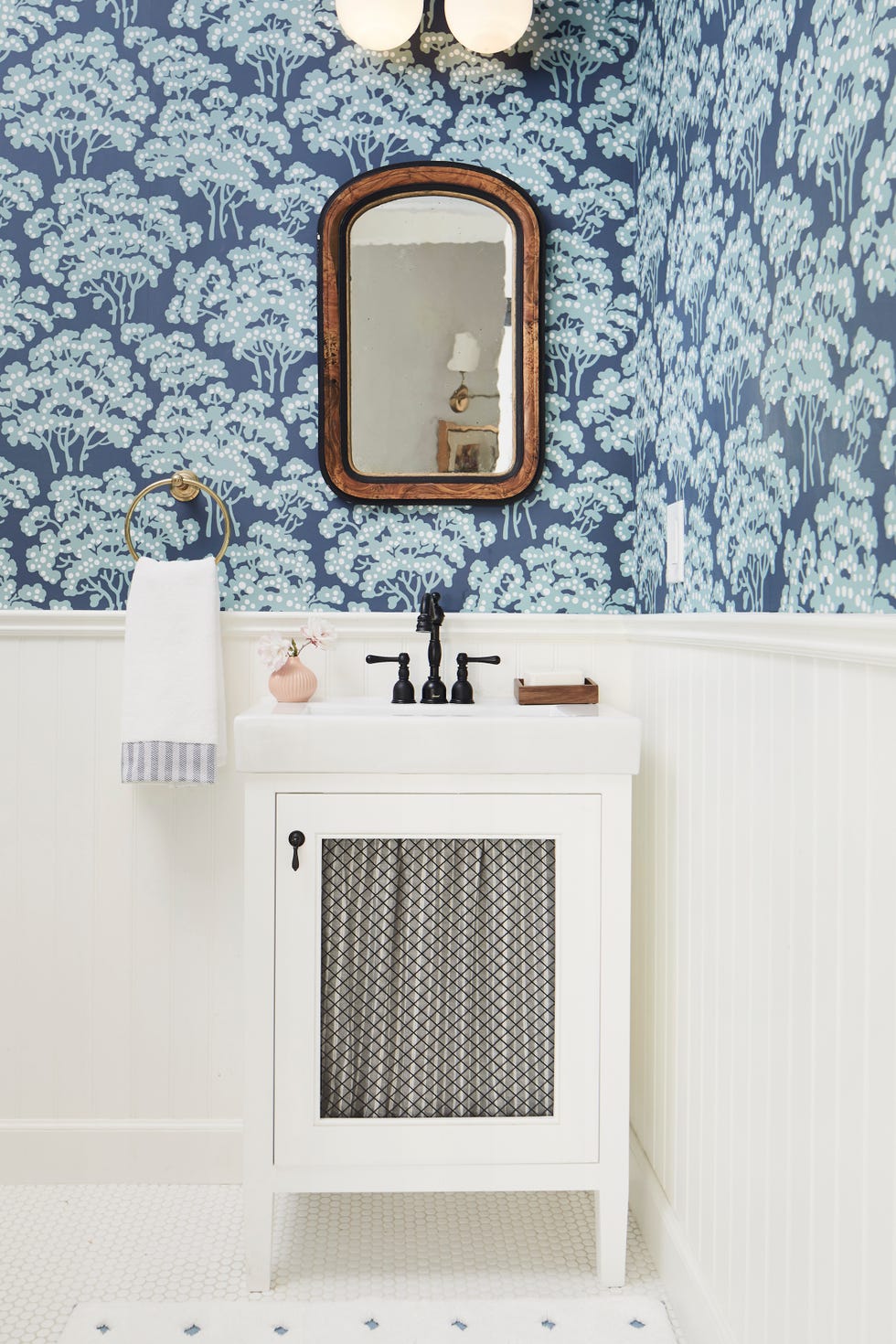 blue and white bathroom with wallpaper