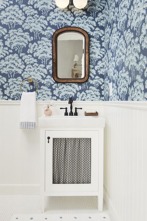 blue and white bathroom with wallpaper