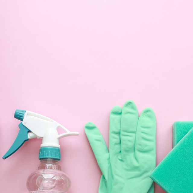 Removing mold on the wall in room. Hand holds spray with anti-mould liquid  and uses it to remove fungus from the wallpaper in the house Stock Photo