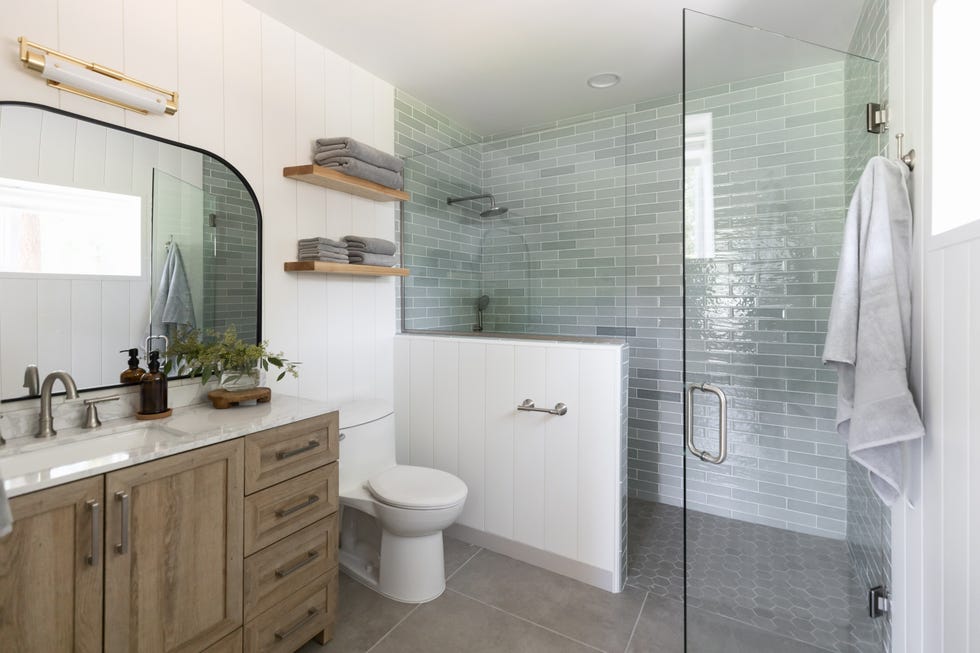 modern bathroom featuring a shower vanity and storage shelves