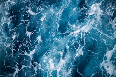 blue deep sea foaming water background