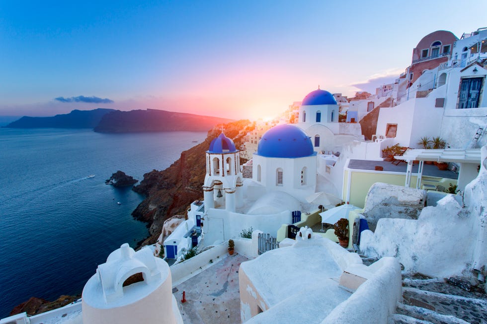 blue domed churches at sunset, oia, santorini