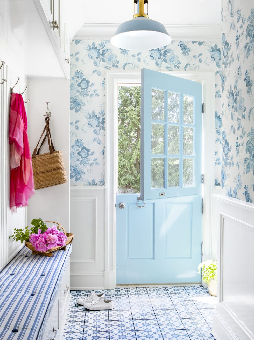 an entryway with a blue dutch door