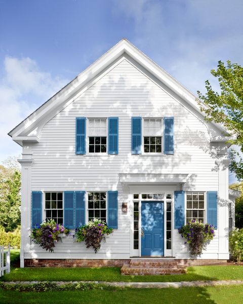 white house with blue shutters and door