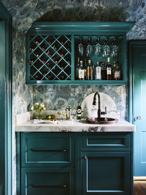 plumbed wet bar
the prep sink and undercounter refrigerator
drawers in this bar by designer vani sayeed
allow for seamless serving and quick
cleanup pull out trays built into the cabinetry
extend counter space in an instant