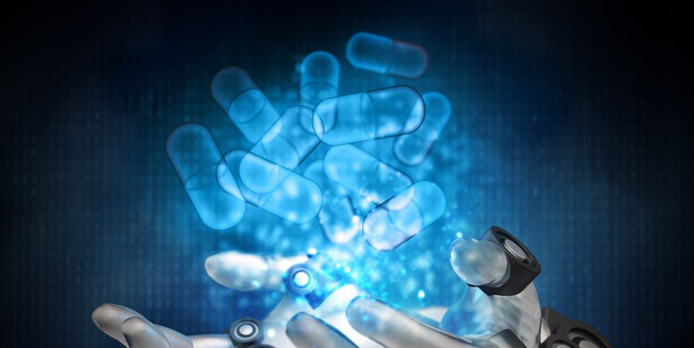 blue pill capsules hologram over robotic hands cyber medicine concept