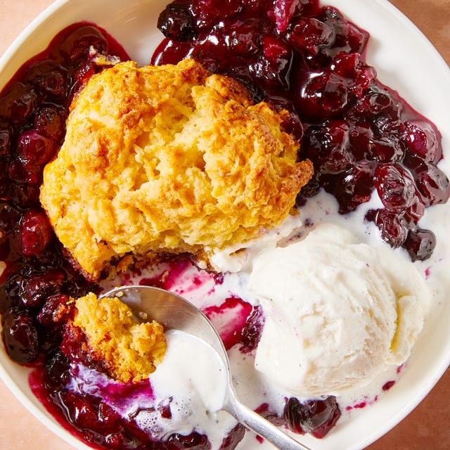 blueberries in a pan topped with biscuits