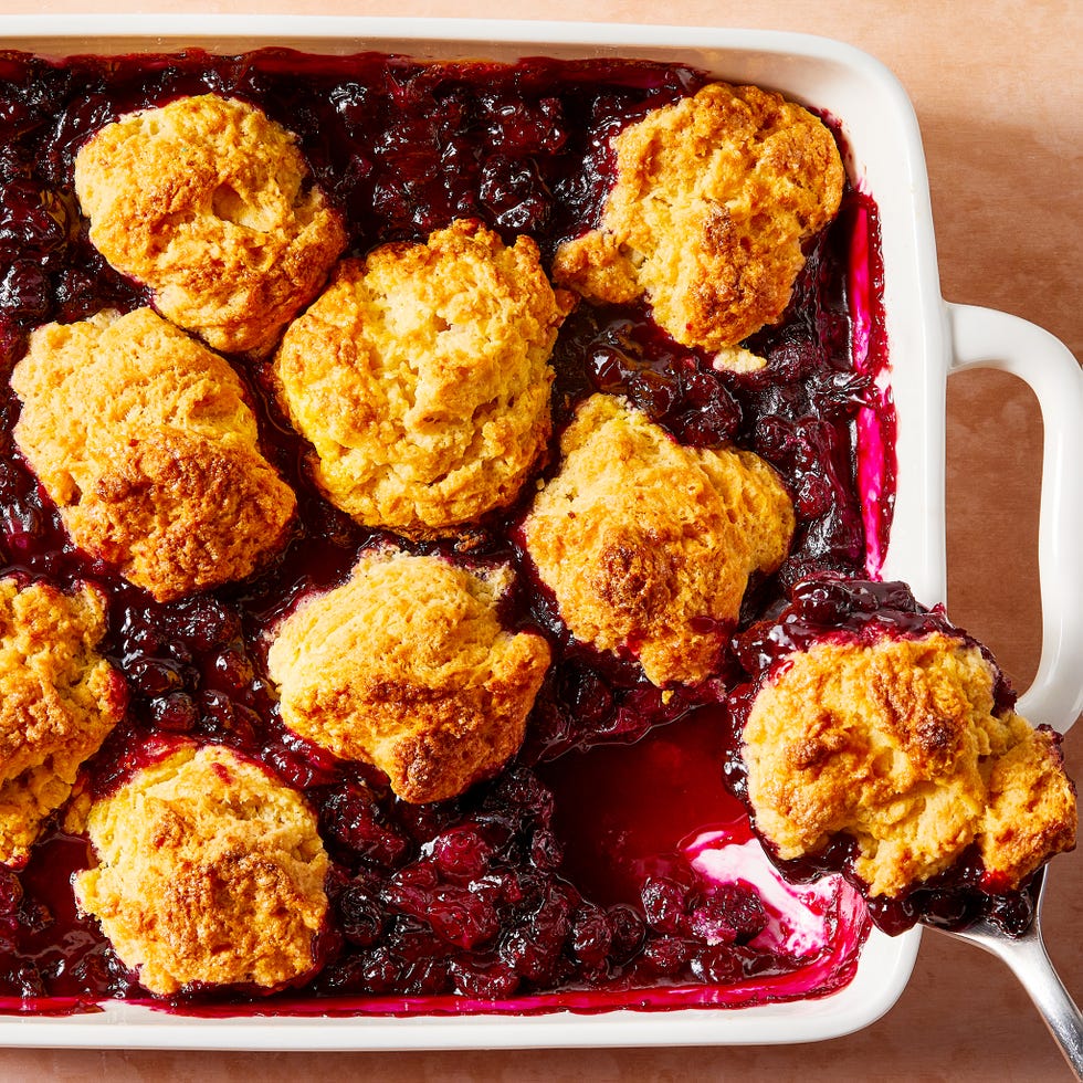 blueberries in a pan topped with biscuits