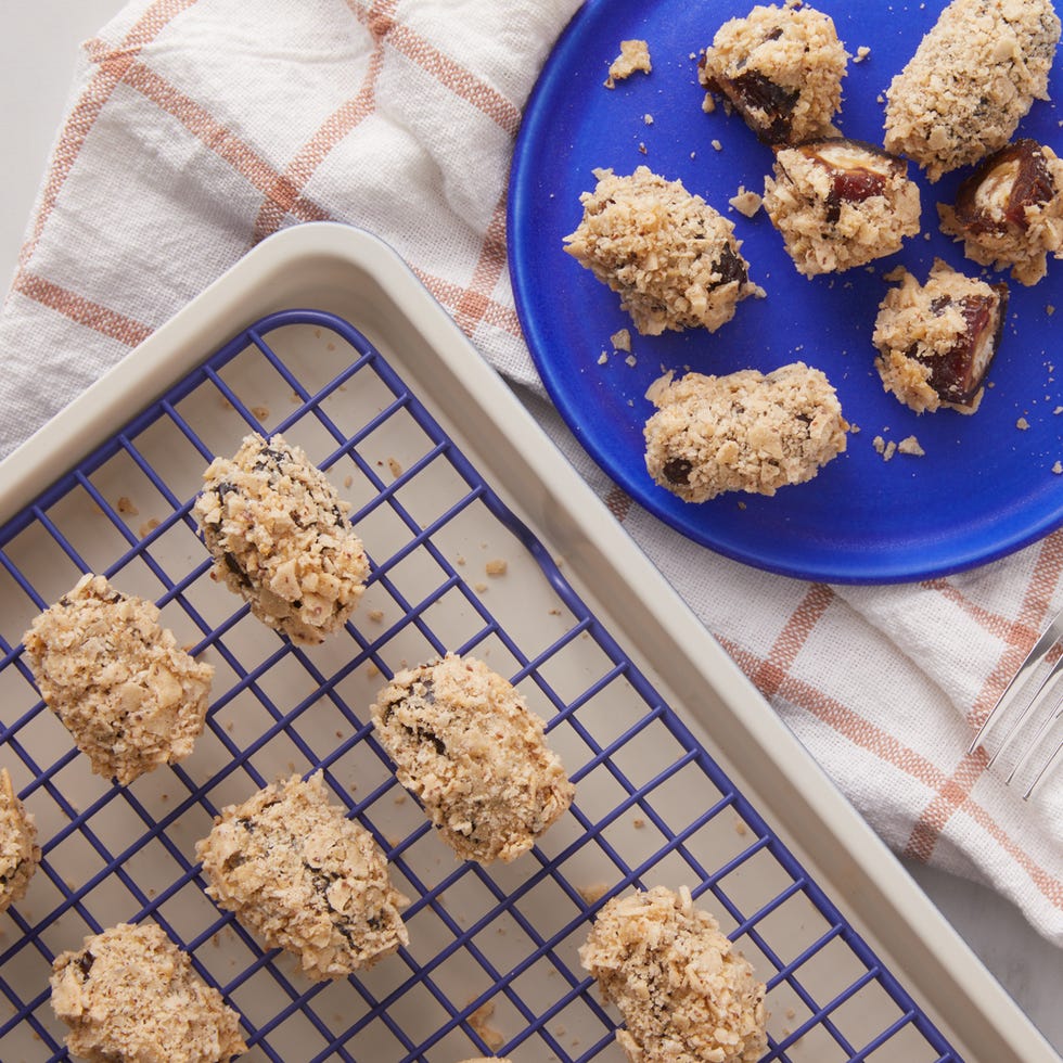 baked treats on a cooling rack alongside a plate of similar items