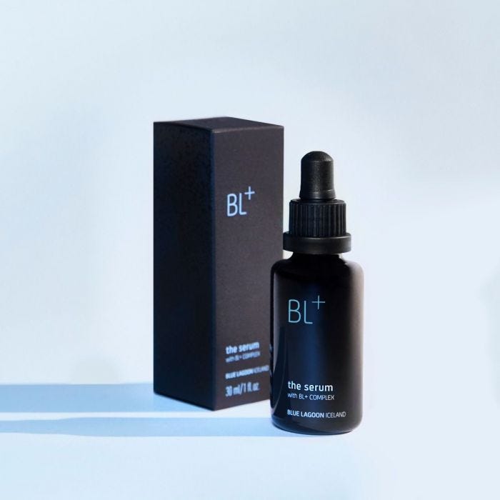 a black dropper bottle of bl plus the serum on a light blue background