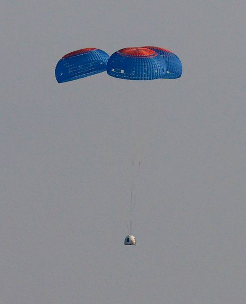 van horn, texas   july 20 blue origin’s new shepard crew capsule descends on the end of its parachute system carrying jeff bezos along with his brother mark bezos, 18 year old oliver daemen, and 82 year old wally funk on july 20, 2021 in van horn, texas mr bezos and the crew are riding in the first human spaceflight for the company   photo by joe raedlegetty images