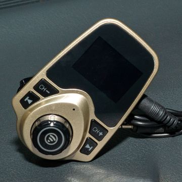 a gold km18 bluetoth adapter, anker bluetooth adapter, and a generic brand bluetoothj adapter with with two knob controls