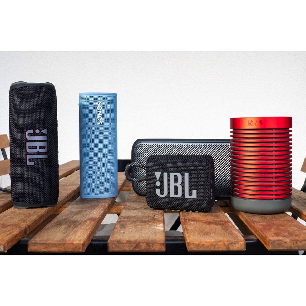 a group of portable bluetooth speakers