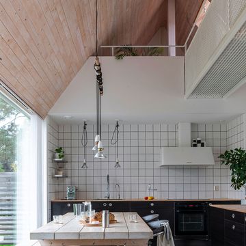 a kitchen with a table and chairs