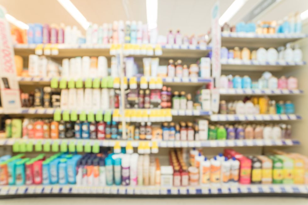 blurred hair care, skin care and cosmetic at pharmacy store