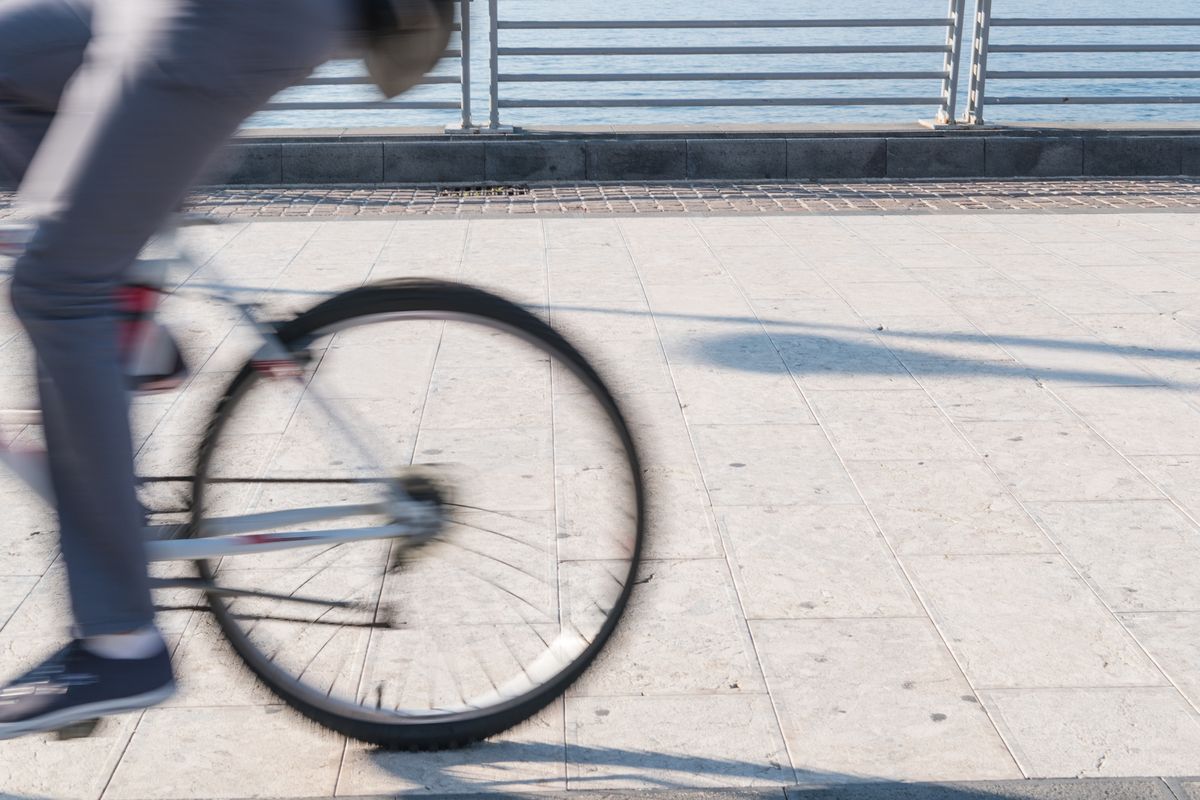 Blurred Motion Of Person On Bicycle Street