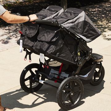 bab double stroller being pushed up a sidewalk