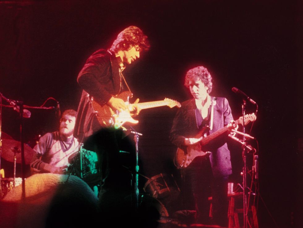 robbie robertson performing with the band at queens college