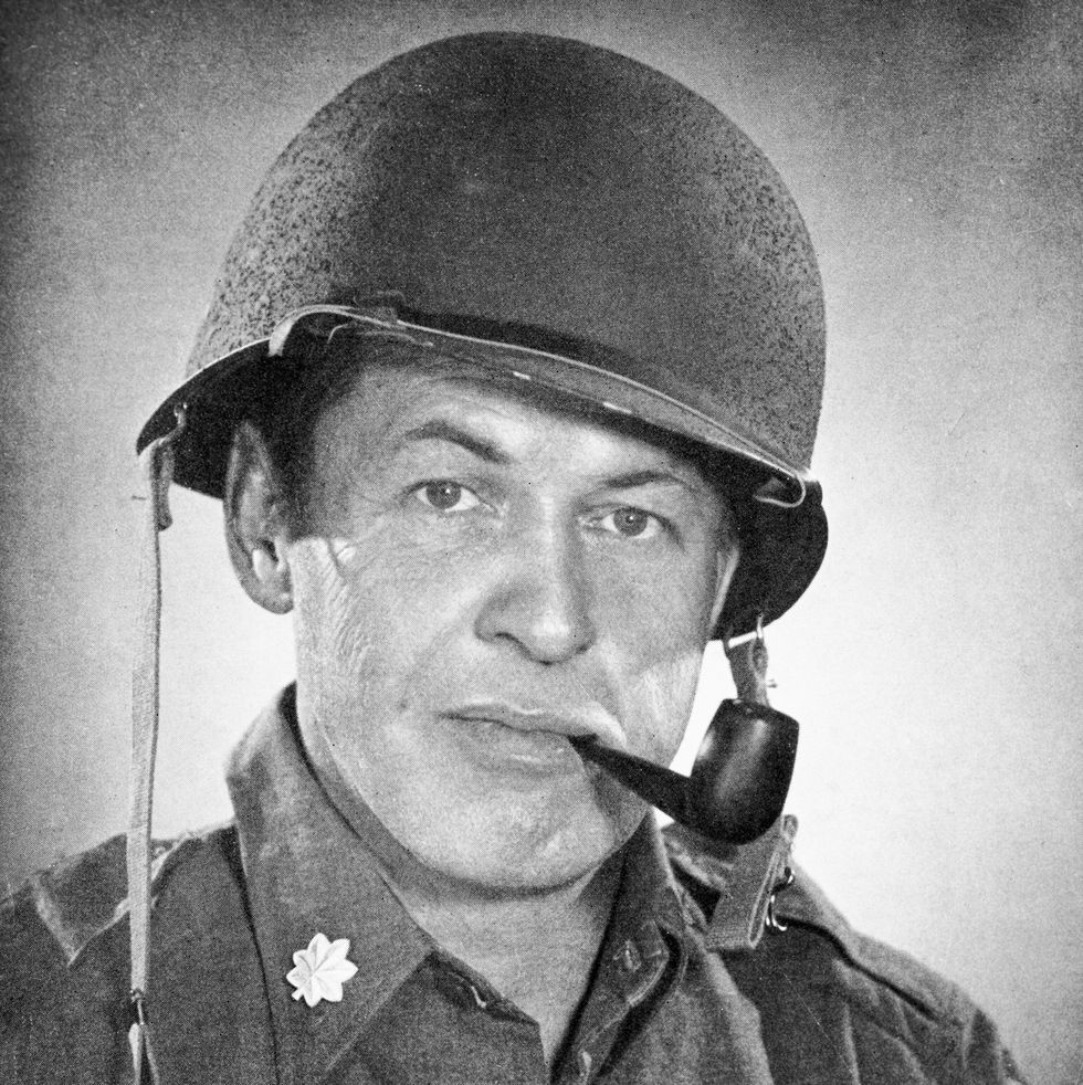 bobby jones posing in his army uniform with a pipe in his mouth