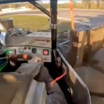 in car footage of a super mod being hit by a push truck