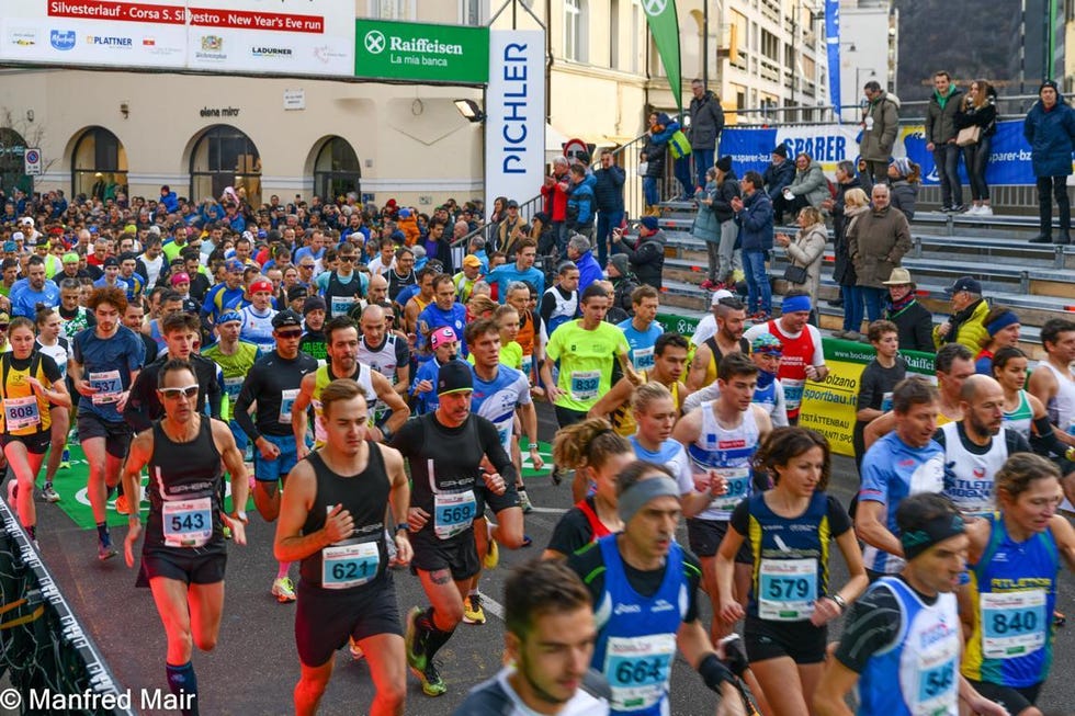 participants in a running event competing on a city street