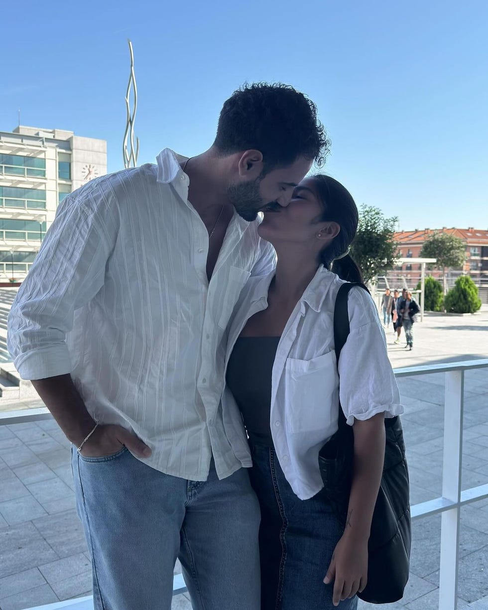 a man and woman kissing