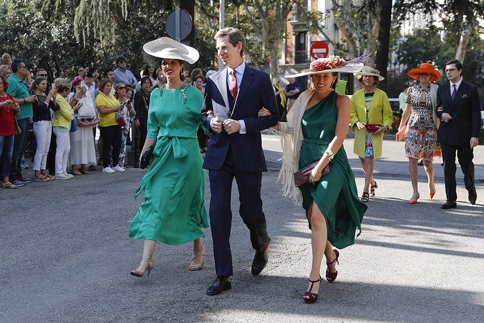 Footwear, Green, Hat, Event, Trousers, Dress, Public space, Tourism, Sun hat, Fashion, 