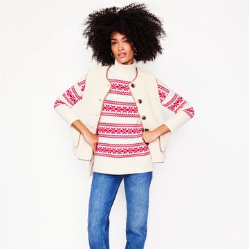 women wearing a festive jumper boden fair isle jumper