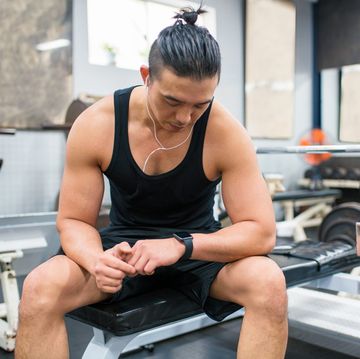 body builder checking his vitals on a smartwatch