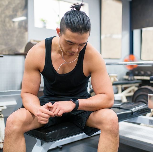 body builder checking his vitals on a smartwatch