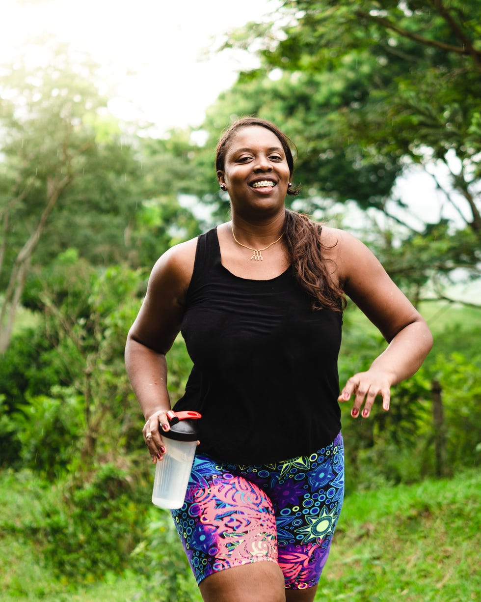 Body positive woman exercising in nature