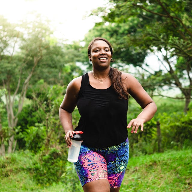 body positive woman exercising in nature