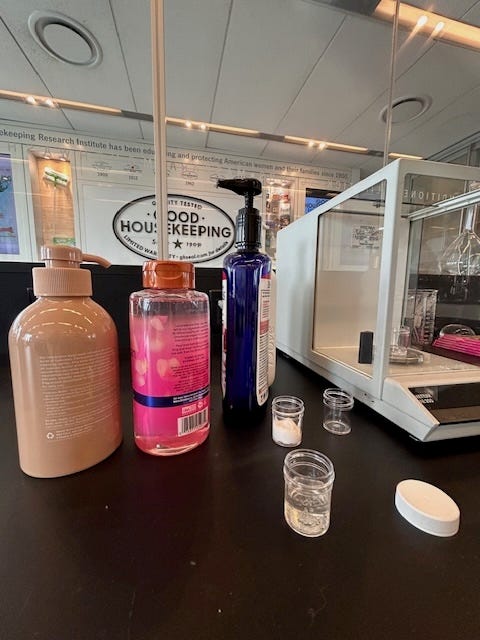 a photo of some body washes being tested in the good housekeeping institute beauty lab