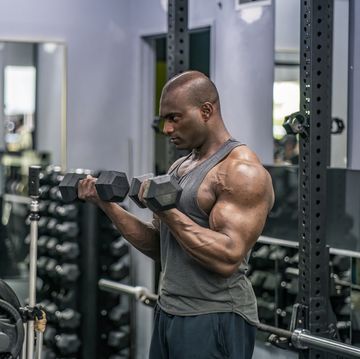bodybuilder weight training in a gym