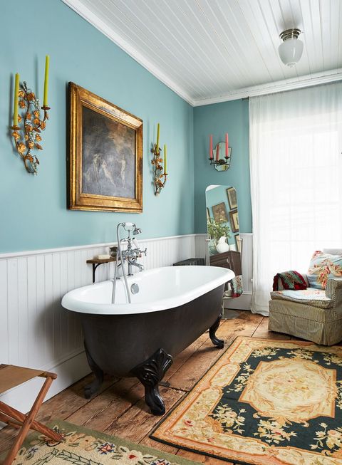bohemian bathroom with black clawfoot tub