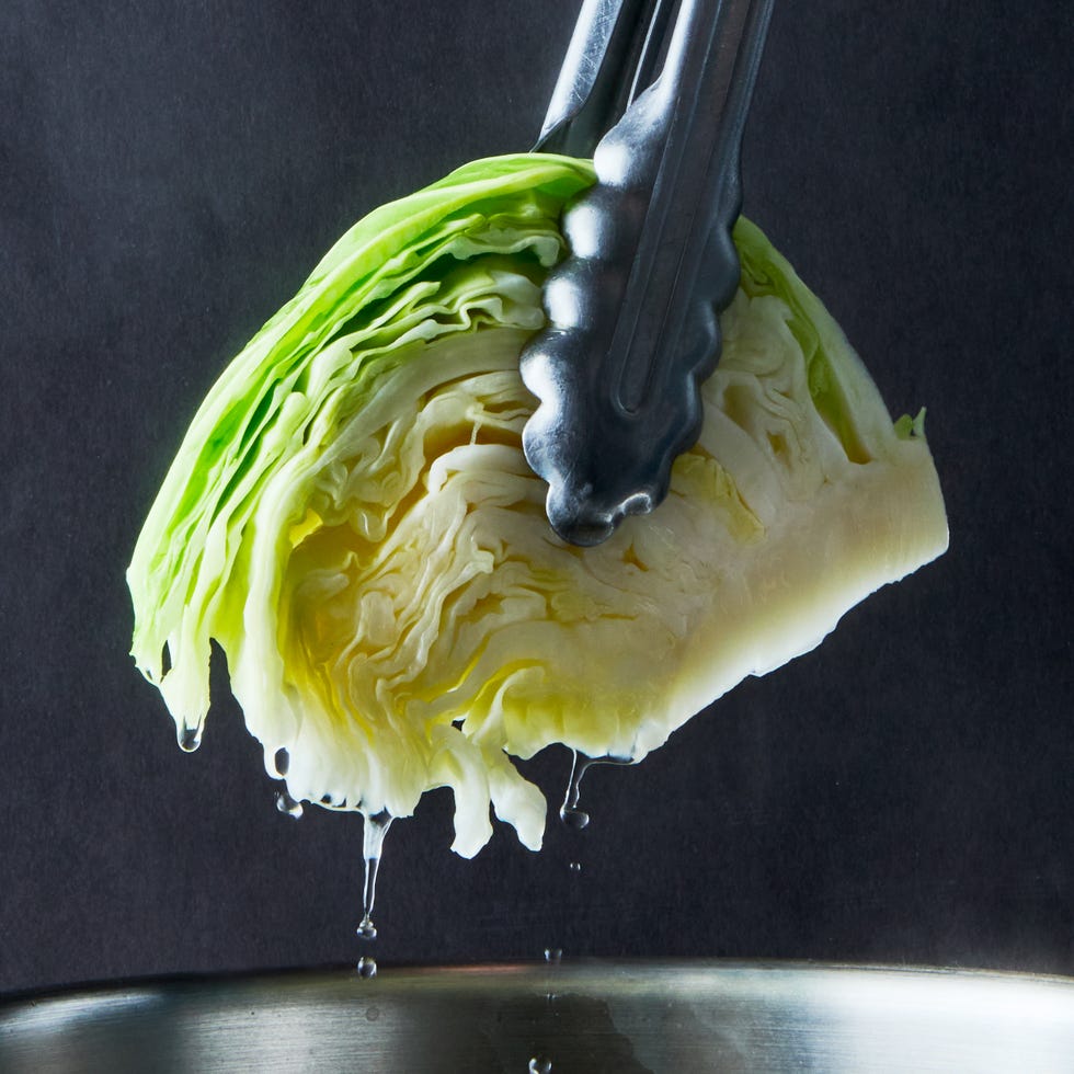 boiled cabbage topped with salt, pepper, and butter