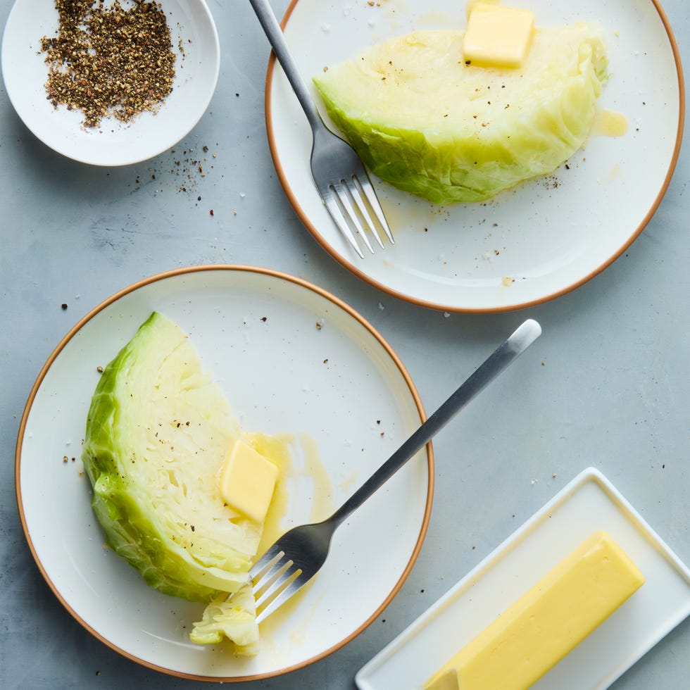 boiled cabbage topped with salt, pepper, and butter