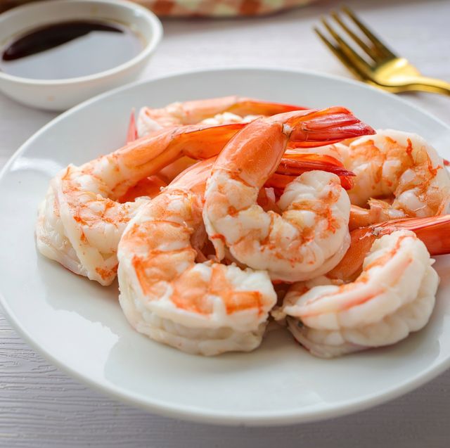 boiled shrimp in white ceramic plate on white background