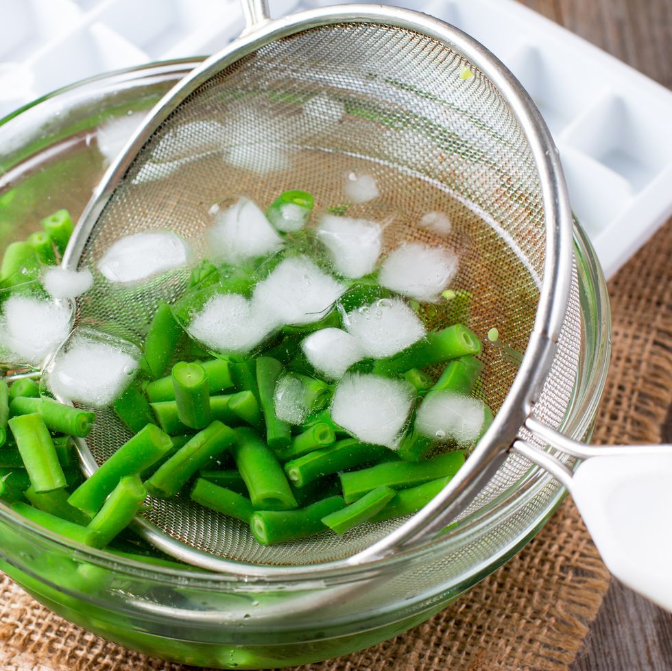 boiled vegetables, green beans  in ice water after blanching