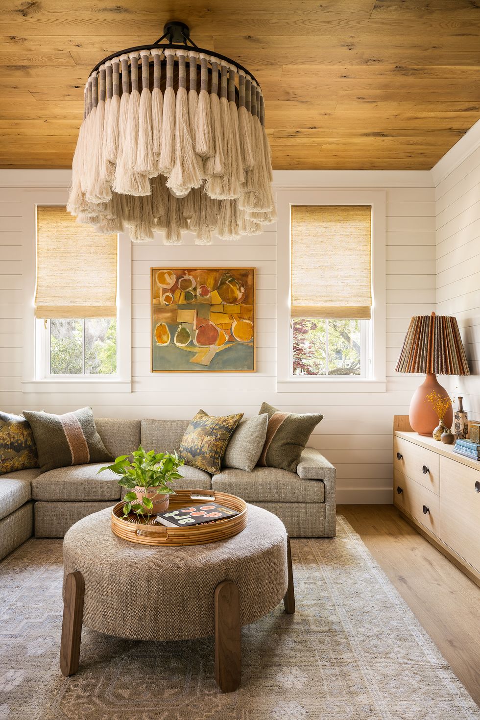 neutral living room with tassel chandelier