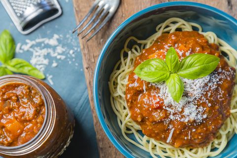 Bolognese spaghetti with cheese and basil
