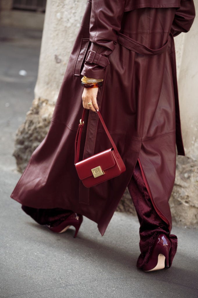 milan, italy september 17 gili biegun wears burgundy corduroy trousers and knitted top by dorothee schumacher, burgundy bag, burgundy leather trench coat, hermes belt, anna rossi jewellery and fendi accessories during the milan fashion week springsummer 2025 on september 17, 2024 in milan, italy photo by raimonda kulikauskienegetty images