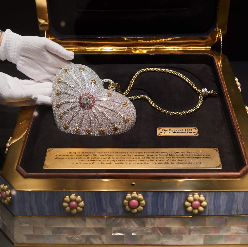 a heart shaped handbag, the mouawad 1001 nights diamond purse, with 4517 incorporated diamonds with a total weight of 38192 carats, is displayed with its presentation case during a christies auction preview in hong kong on october 17, 2017 the robert mouawad designed bag holds the world record for the most valuable handbag ever produced, with an original price of 38 million usd in 2010  afp photo  anthony wallace photo credit should read anthony wallaceafp via getty images